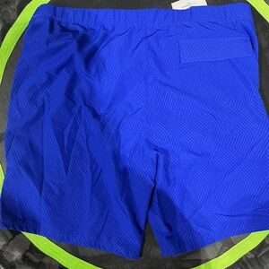 Men’s XXL swimming trunks. Royal blue with bright yellow trim.